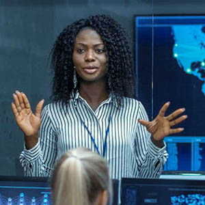 intelligence professional explaining something to colleagues